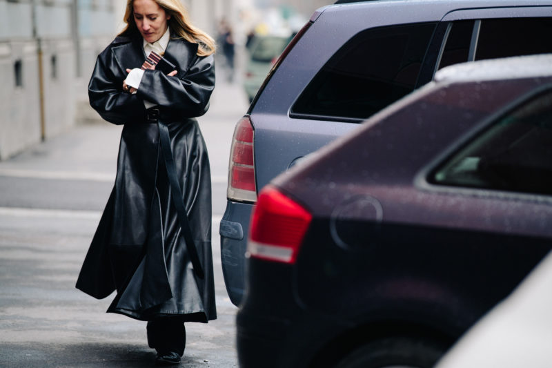 Woman wearing long leather coat
